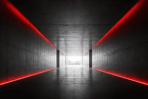Dark corridor lit by red lines — the KIWAMI command center